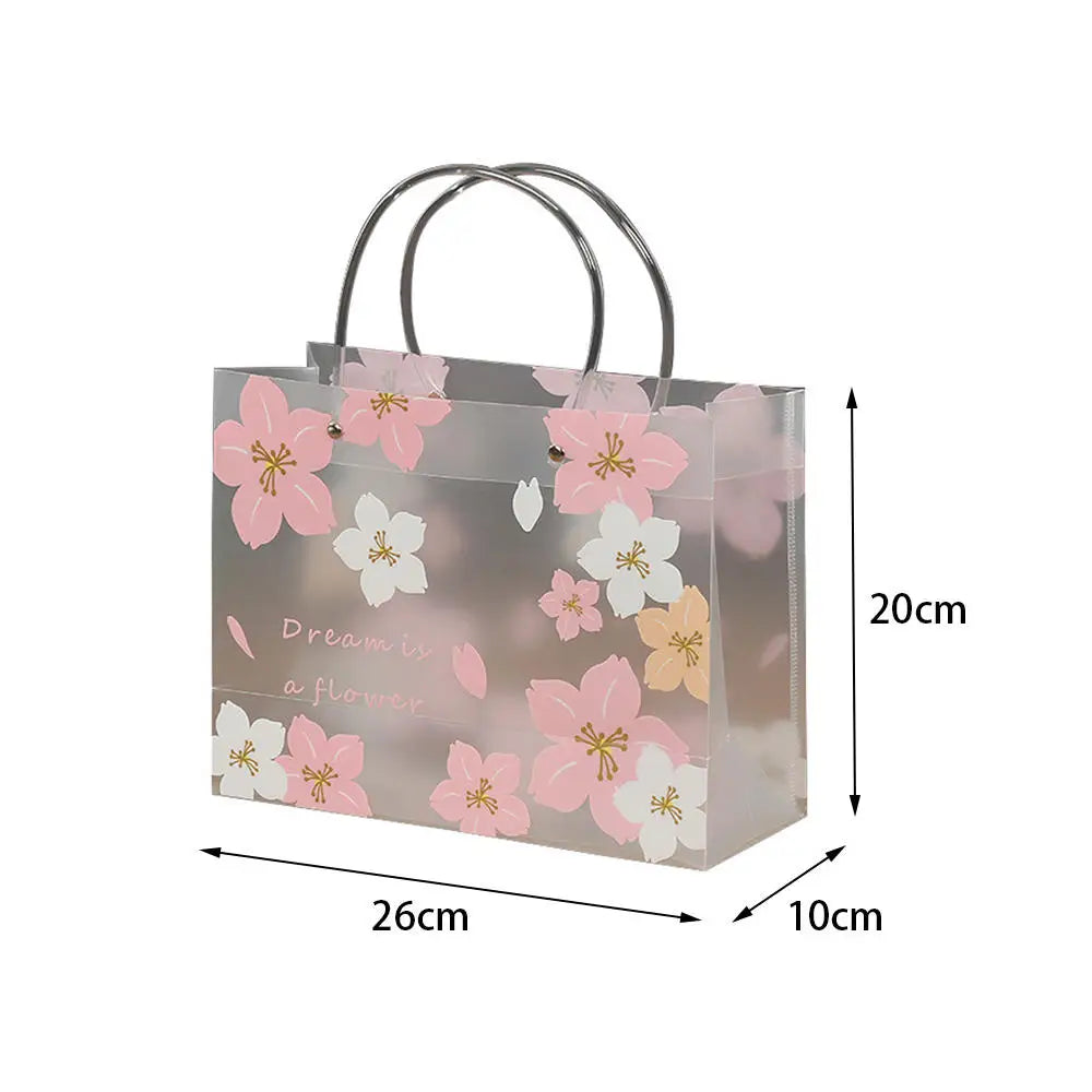 Élégance Florale et Robustesse au Quotidien : Le Sac Cadeau Transparent Portable qui Révolutionne Vos Emballages