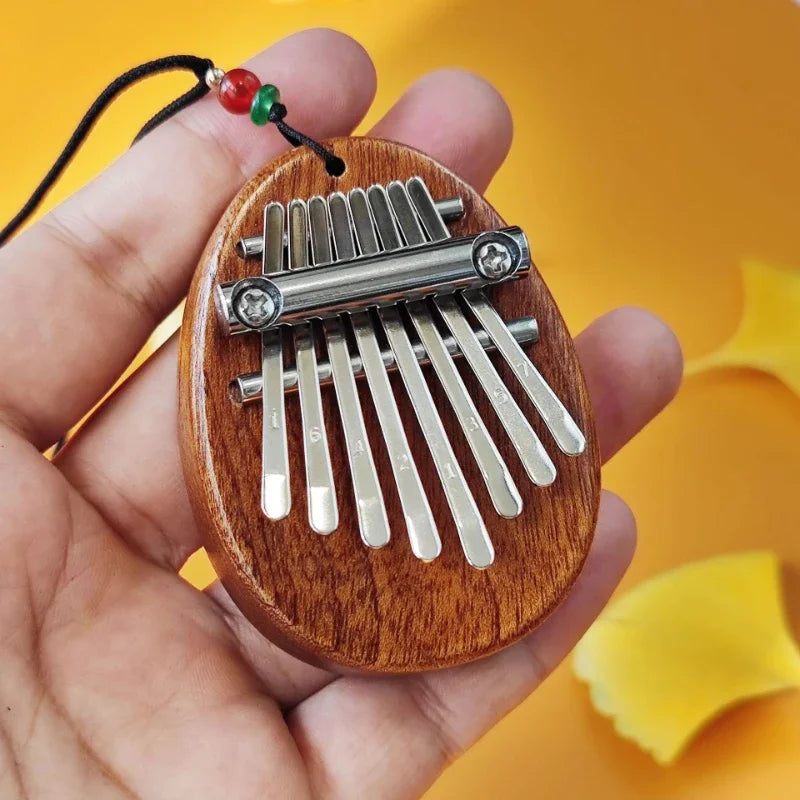 Découvrez l'Alchimie des Sons avec le Mini Kalimba 8 Touches