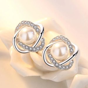 La touche raffinée pour sublimer vos looks : boucles d'oreilles en argent 925 avec zircon et perle